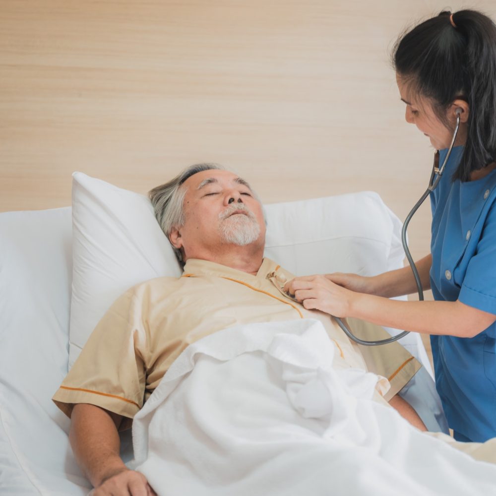 nursing-home-care-concept-the-healthy-nurse-helping-support-and-checking-the-elderly-male.jpg